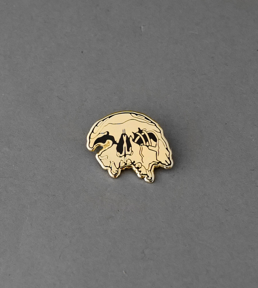 Crushed Skull Gold Pin